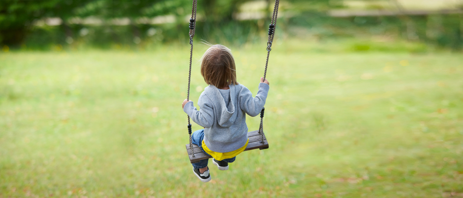 little kid on swing